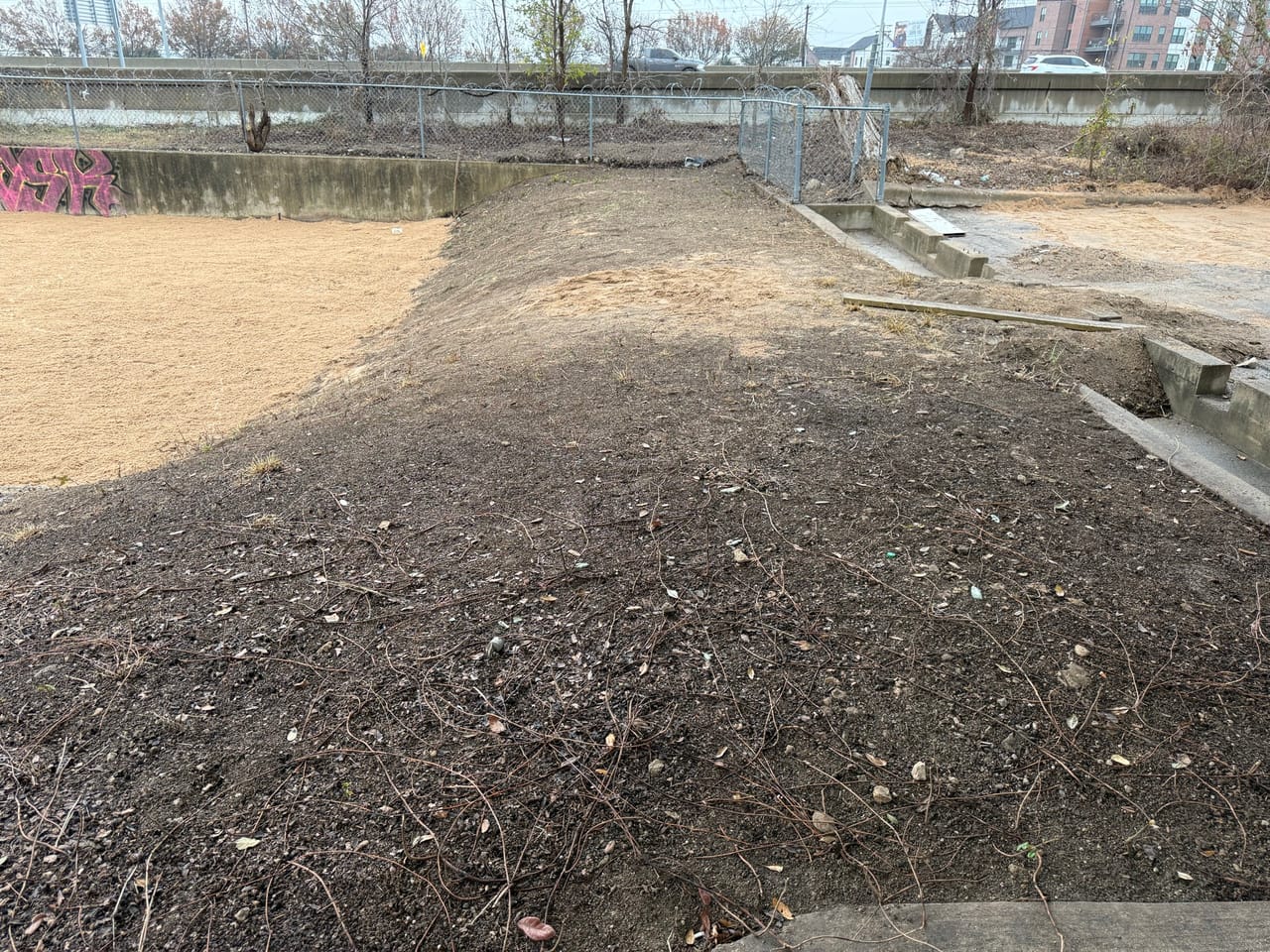 Close view of a freshly graded bare soil mound in flat light in Leander, TX