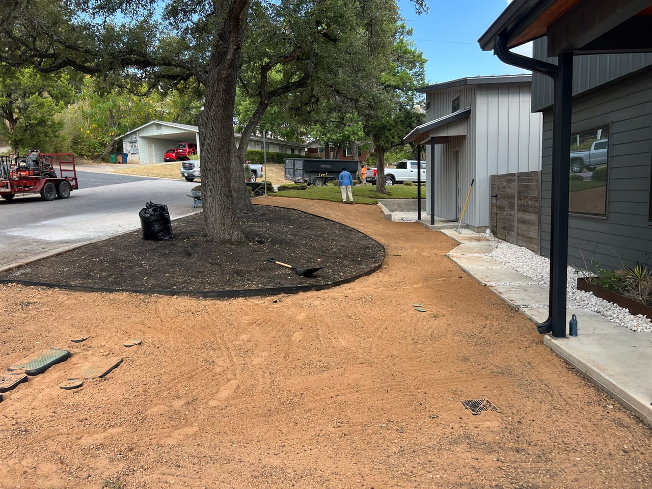 Decomposed granite ring around an oak in a finished front yard in Kyle, TX