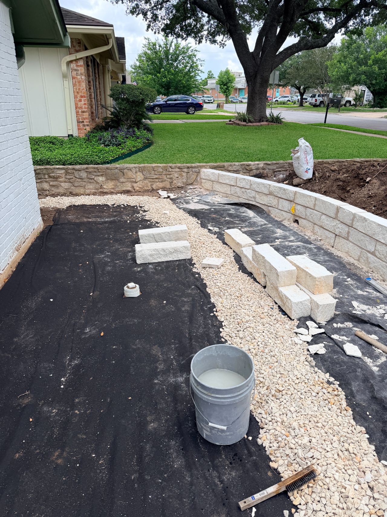 Stone retaining wall front yard austin by Corral Bros in Central Texas